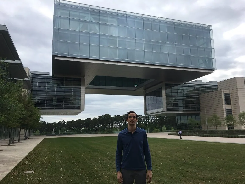Tyler Garrett, founder of Dev3lop, on-site at ExxonMobil's Houston, Texas headquarters delivering data engineering, Alteryx ETL, and Tableau dashboard consulting